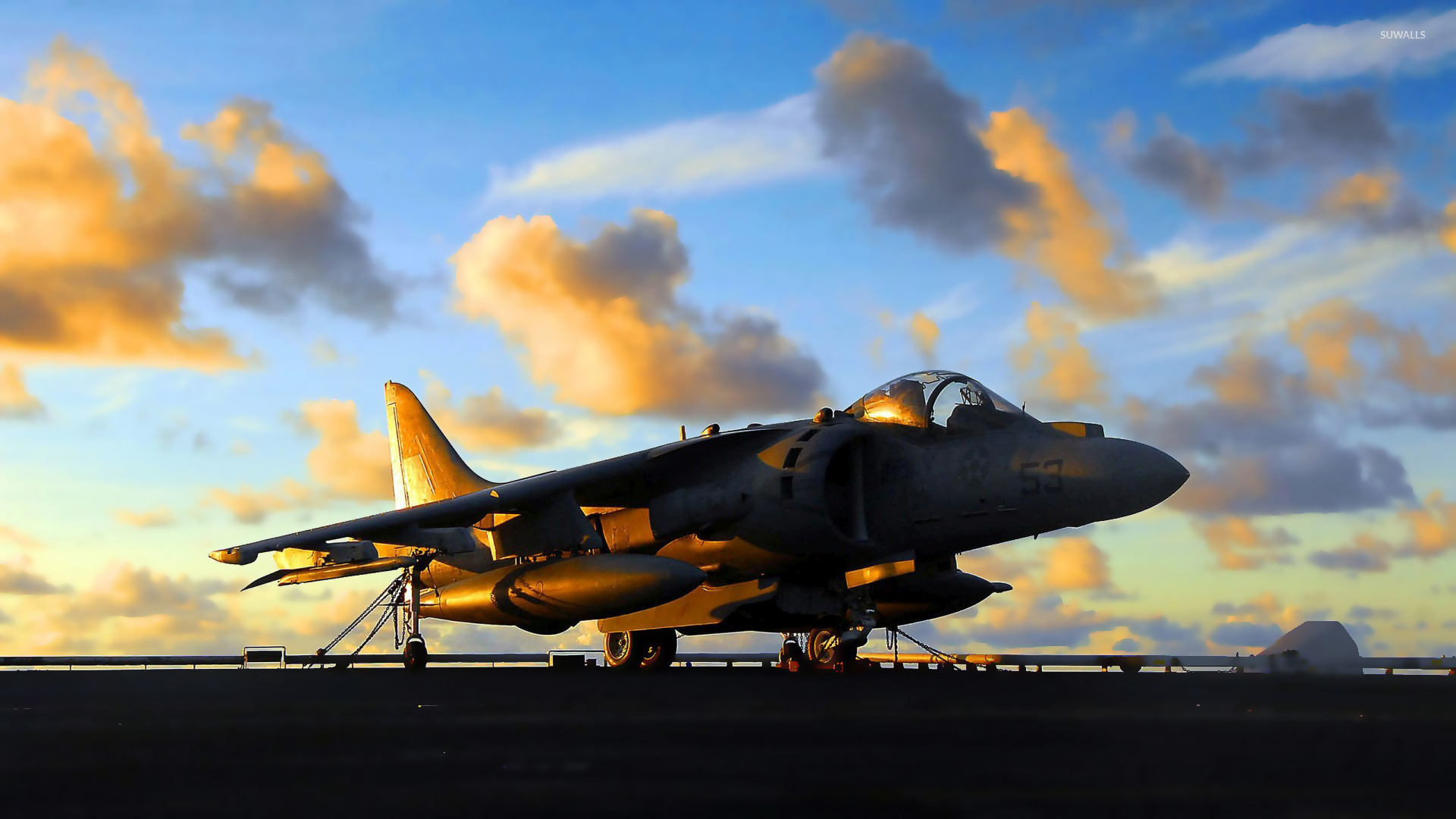 Sunset light reflecting on a Harrier Jump Jet wallpaper 