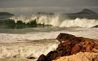 Foamy wave splashing on the rocky shore wallpaper 1920x1200 jpg