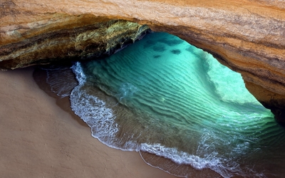 Sandy beach in the cave Wallpaper
