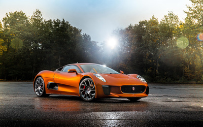 Jaguar C-X75 parked in front of the forest Wallpaper