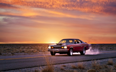 Plymouth Duster on the road at sunset wallpaper