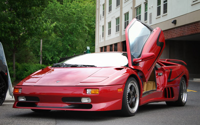 Red Lamborghini Diablo with an open door front side view wallpaper