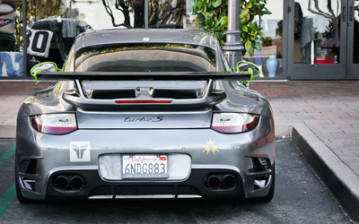 Silver Porsche 911 turbo S back view wallpaper