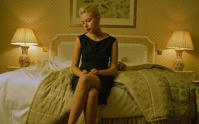 Scarlett Johansson on a bed wallpaper