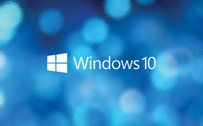 Windows 10 text logo over the blue bokeh wallpaper