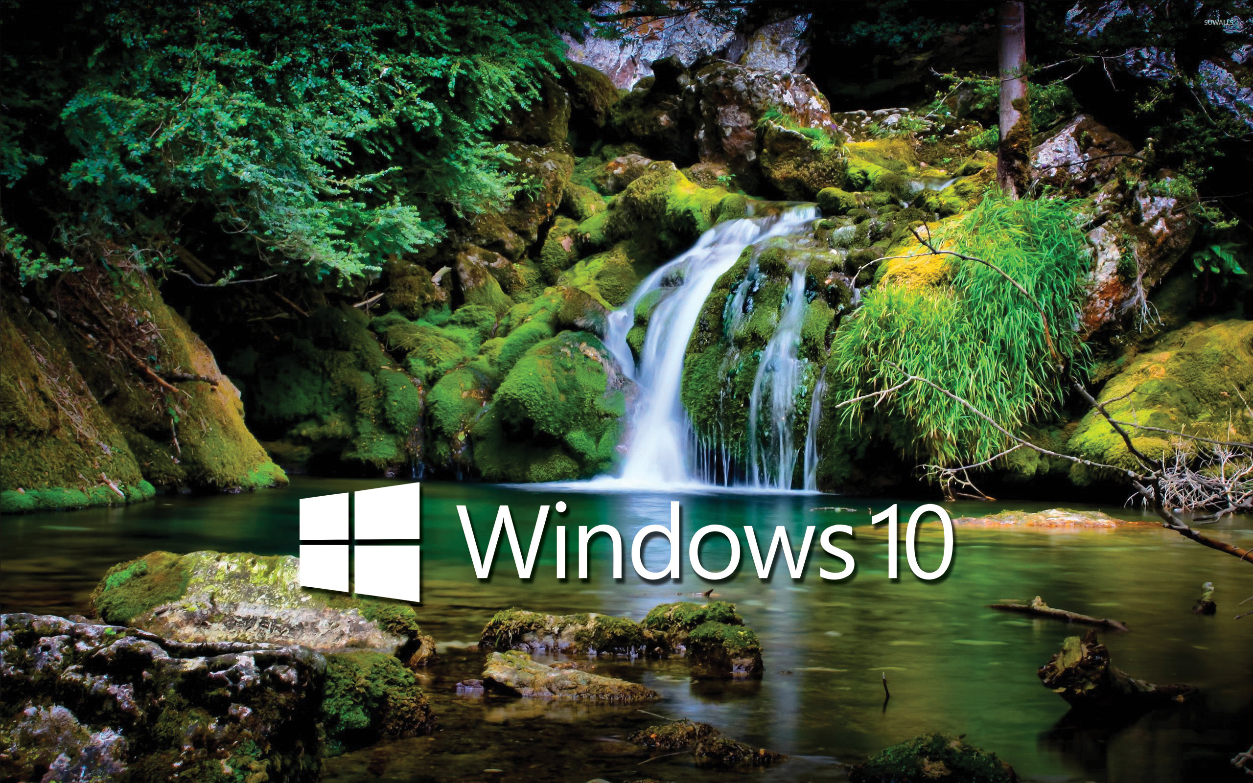 Windows 10 white text logo over the waterfall wallpaper ...