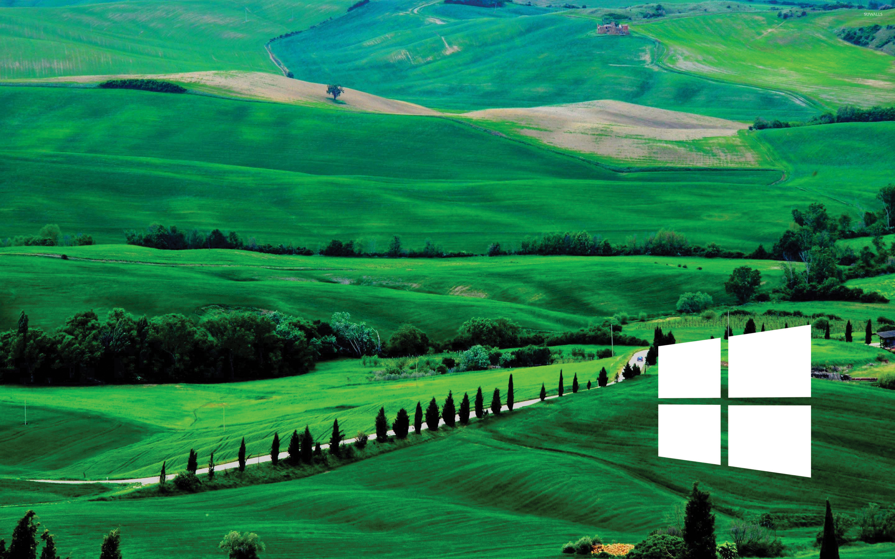 Windows 10 white simple logo over the green hills wallpaper - Computer