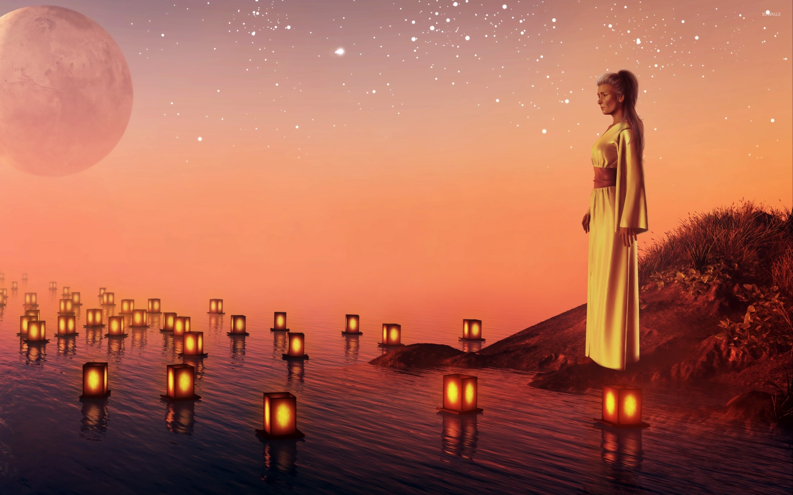 Sad woman watching the candles floating on the water ...