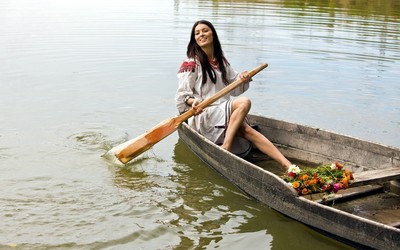 Beautiful woman on a boat wallpaper