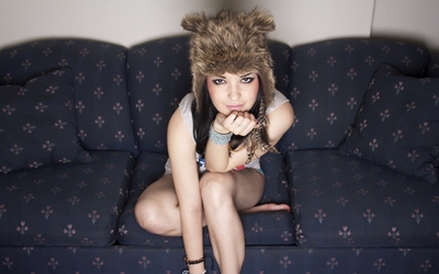 Girl with a funny furry hat Wallpaper