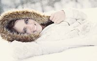 Girl with blue eyes lying in the snow wallpaper 1920x1200 jpg