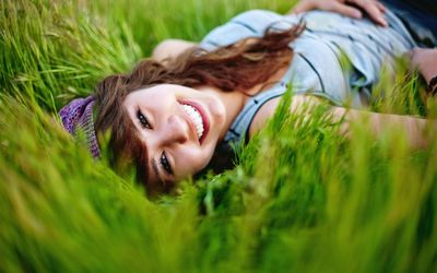Happy girl in the grass wallpaper
