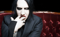 Marilyn Manson on a red sofa wallpaper 2560x1600 jpg