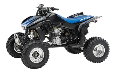Front side view of a blue 2014 Honda TRX450R Wallpaper