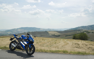 Yamaha YZF-R125 on the side of the road wallpaper