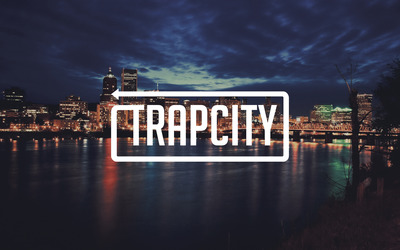 Trap City in a cloudy city night wallpaper