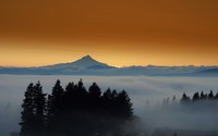 Amazing sunset behind the mountain rising from the fog wallpaper 2560x1600 jpg