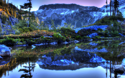 Blue winter in the mountains by the lake Wallpaper