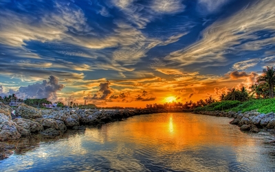 Breathtaking golden sunset merging with the lake wallpaper