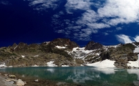 Dark blue sky with white fluffy clouds above the lake wallpaper 2560x1600 jpg
