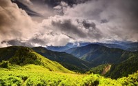 Green forest mountains aspiring to the fluffy clouds wallpaper 1920x1200 jpg