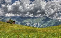 Heavy clouds shadowing the green mountains wallpaper 1920x1080 jpg