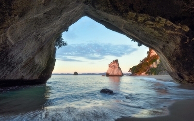 Rocky arch by the water wallpaper