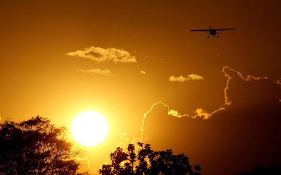 Airplane silhouette in the sunset wallpaper