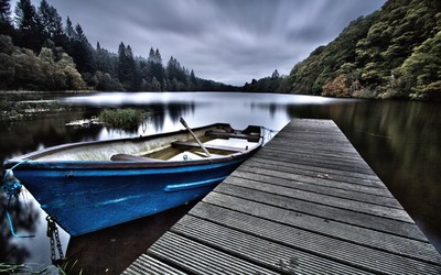 Boat on a mountain lake Wallpaper