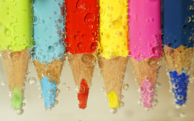 Colored pencils under water wallpaper