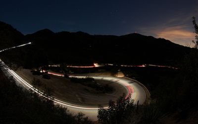 Road in the mountains at night Wallpaper