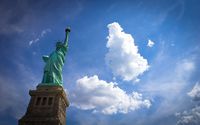 Fluffy clouds above the Statue of Liberty wallpaper 1920x1200 jpg