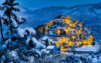 Golden lights on the village on top of the hill wallpaper
